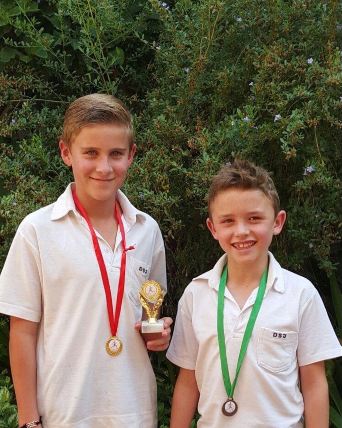 Michael as a boy, holding a running trophy